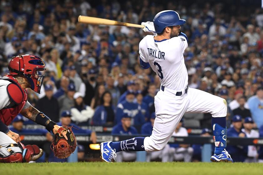 Los Angeles, CA - October 06: Los Angeles Dodgers' Chris Taylor hits the game-winning two-run home run during the ninth inning against the St. Louis Cardinals at Dodger Stadium on Wednesday, Oct. 6, 2021 in Los Angeles, CA. (Wally Skalij / Los Angeles Times)