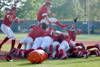 Orange Lutheran players celebrate winning the Division I regional championship.