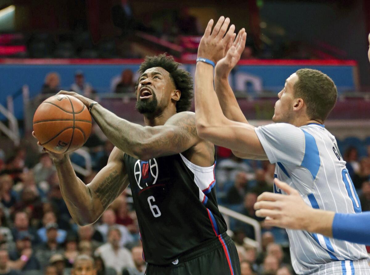 Clippers center DeAndre Jordan looks to score inside against Magic forward Aaron Gordon during the first half.