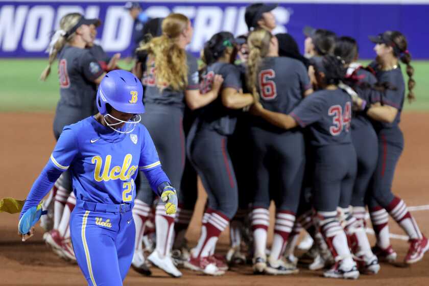 UCLA's Taylor Stephens (22) walks off the field as Stanford celebrates