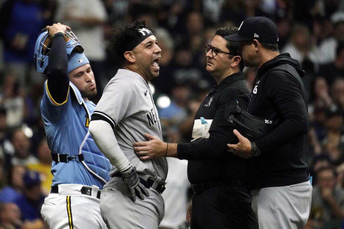 Yanks' Gonzalez exits after catcher's throw hits him on head