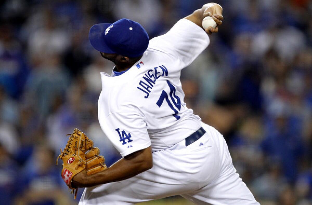 Dodgers reliever Kenley Jansen delivers a pitch against the Phillies in the ninth inning Thursday night, when his fastball was consistently clocked in the 95- to 96-mph range.