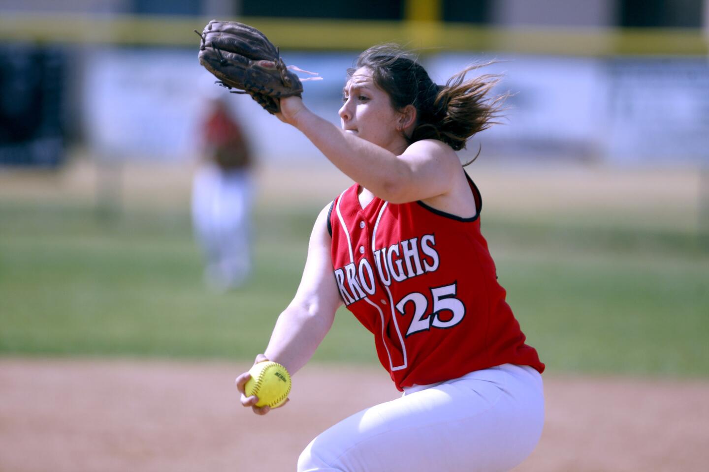 Burroughs High School softball pitcher #25 Presley Miraglia throws in game vs. Crescenta Valley High School at the Falcons home field in La Crescenta on Thursday, April 27, 2017.