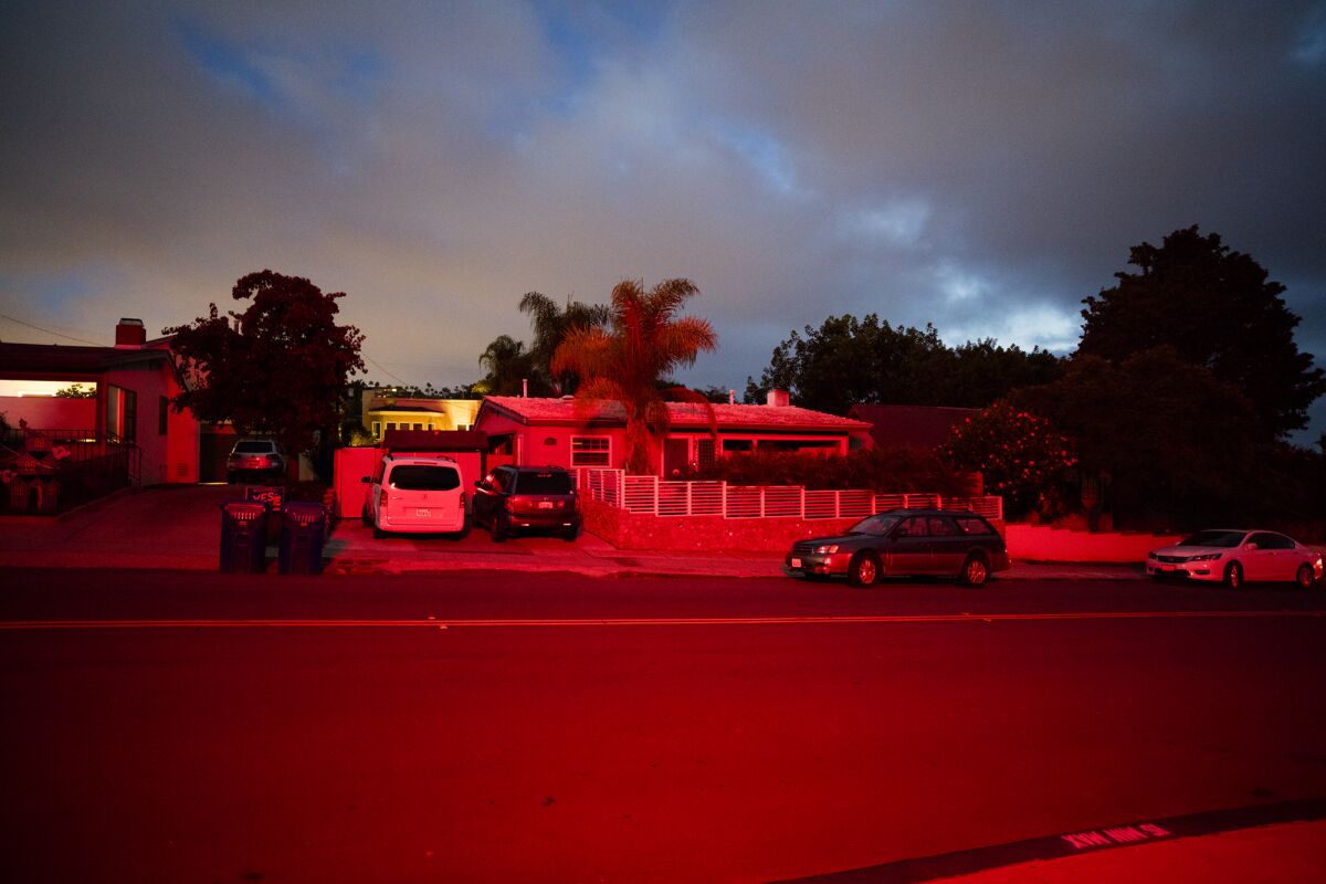 Michael Sangiolo's home is illuminated at night when the La Jolla High School marquee timer doesn't shut off the lights.