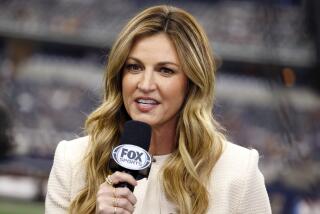 Broadcast sidline reporter Erin Andrews files a report during the first half of a NFL football game between the Washington Commanders and Dallas Cowboys in Arlington, Texas, Sunday, Oct. 2, 2022. (AP Photo/Ron Jenkins)