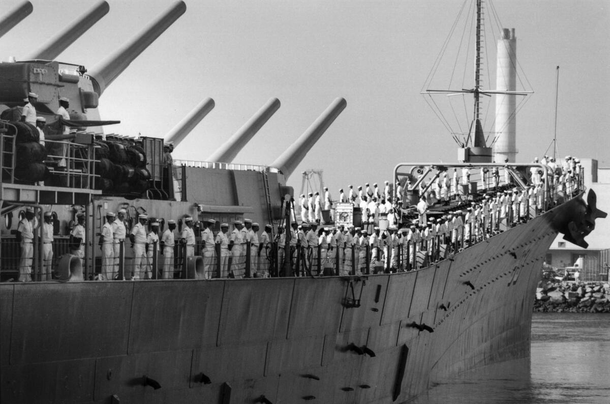 Nov. 13, 1990: The crew of the Missouri lines the battleship railing as the ship leaves Long Beach Naval Station for deployment to the Persian Guil. This photo appeared in the Nov. 14, 1990, Los Angeles Times.