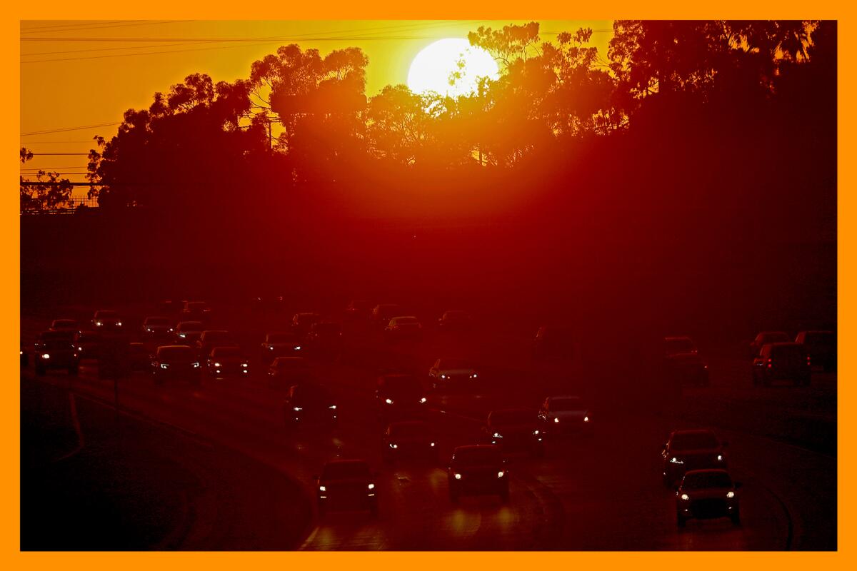 The sun setting over traffic on the 405 Freeway