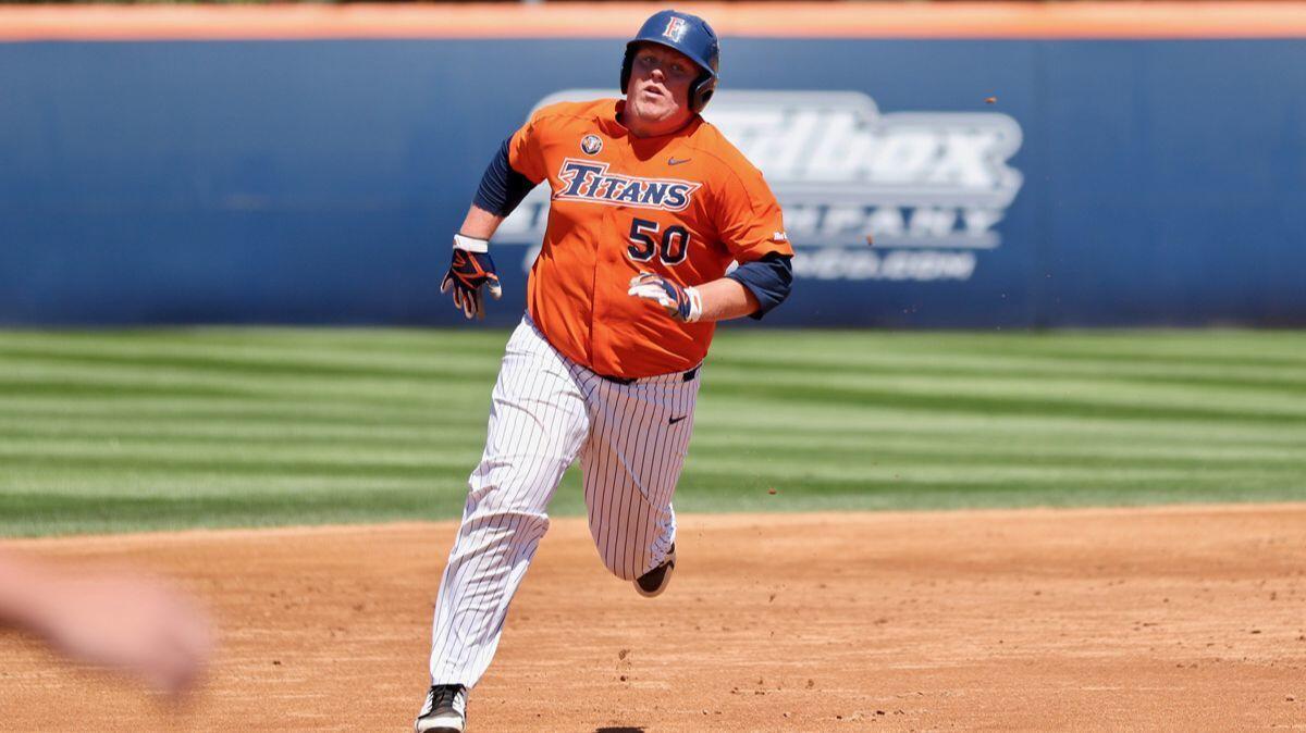 Cal State Fullerton freshman Jace Chamberlin sprints to third base on a hit-and-run play against Hawai'i on April 22.