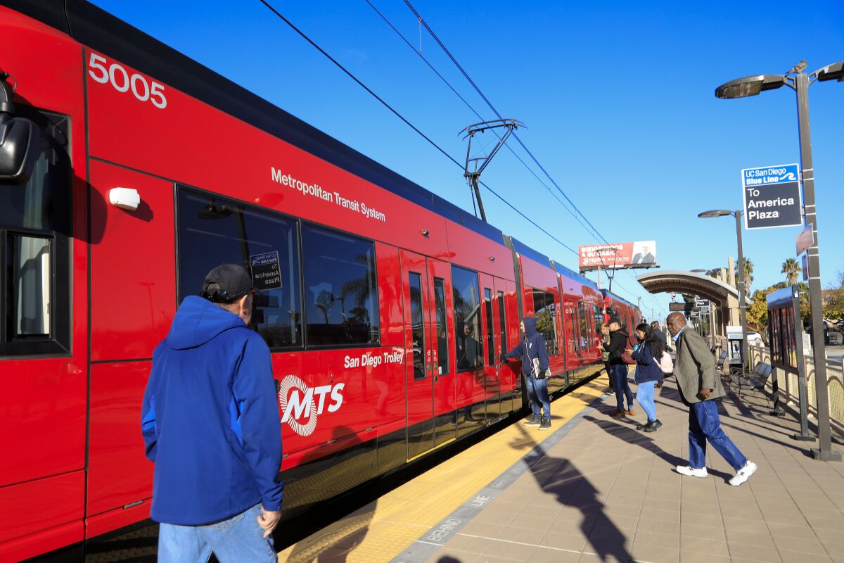 A Metropolitan Transit System trolley pulls into the E Street station in Chula Vista. The San Diego Association of Governments approved a plan with $204 billion in transportation funding, including $100 billion for mass transit.