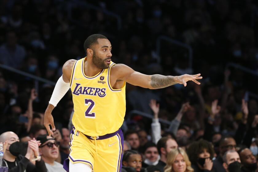 Los Angeles Lakers guard Wayne Ellington (2) reacts after scoring a 3-pointer against the Sacramento Kings during the second half of an NBA basketball game in Los Angeles, Friday, Nov. 26, 2021. The Kings won 141-137 in triple overtime. (AP Photo/Ringo H.W. Chiu)