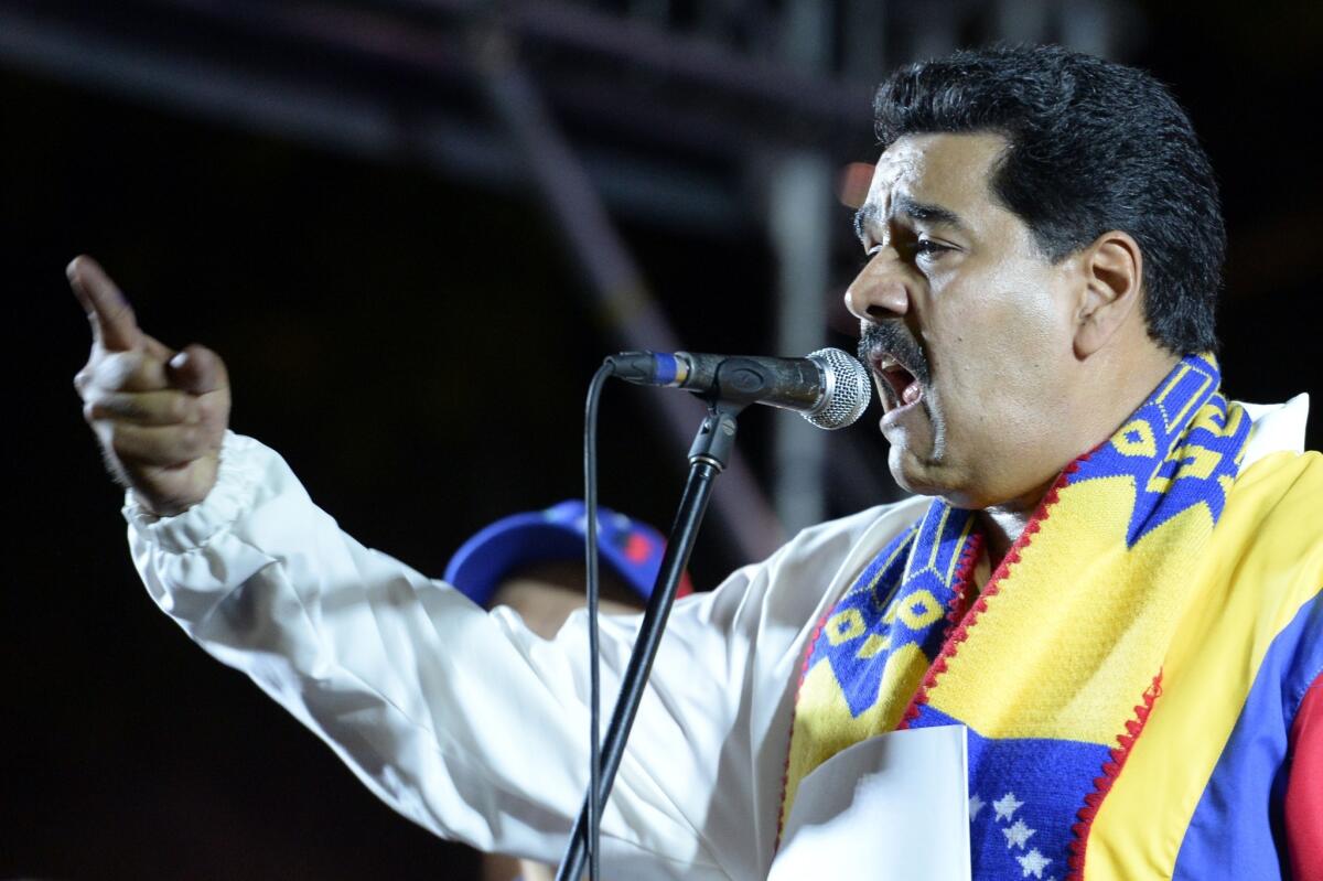 Venezuelan President Nicolas Maduro gives a speech after the first official results from municipal elections were announced in Caracas.