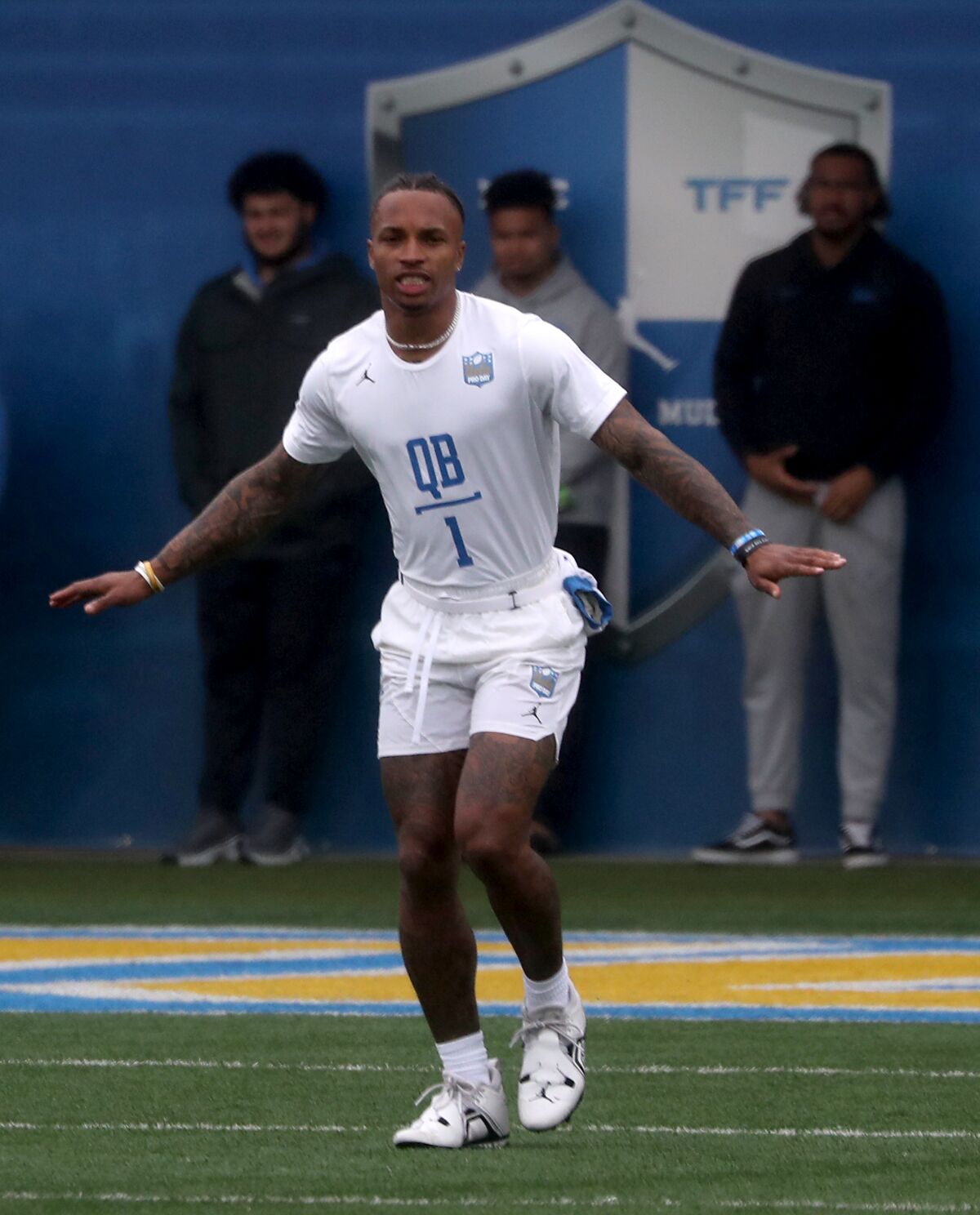 UCLA quarterback Dorian Thompson-Robinson (1) works out for scouts at the school's pro day ahead of the NFL draft.