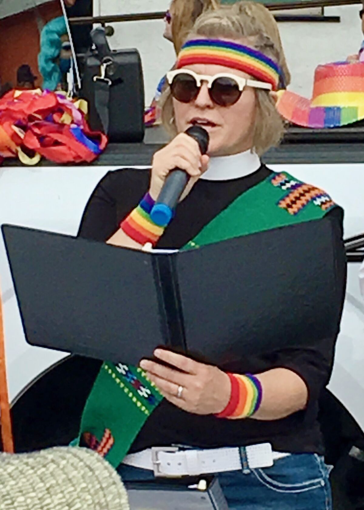 Hannah Wilder leads a prayer service at a 2019 Pride event where she walked in a parade with other church members.
