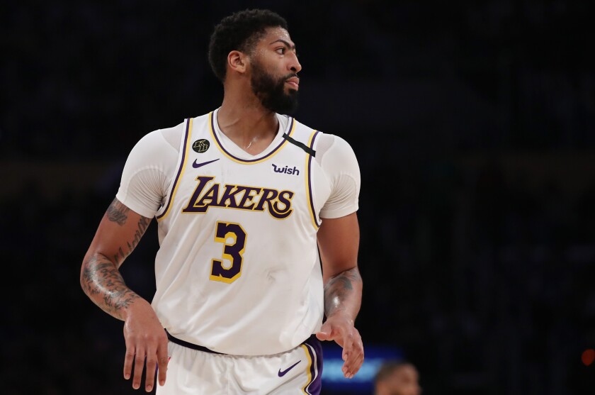 Lakers forward Anthony Davis heads back on defense after scoring against the Celtics during a game Feb. 23, 2020.