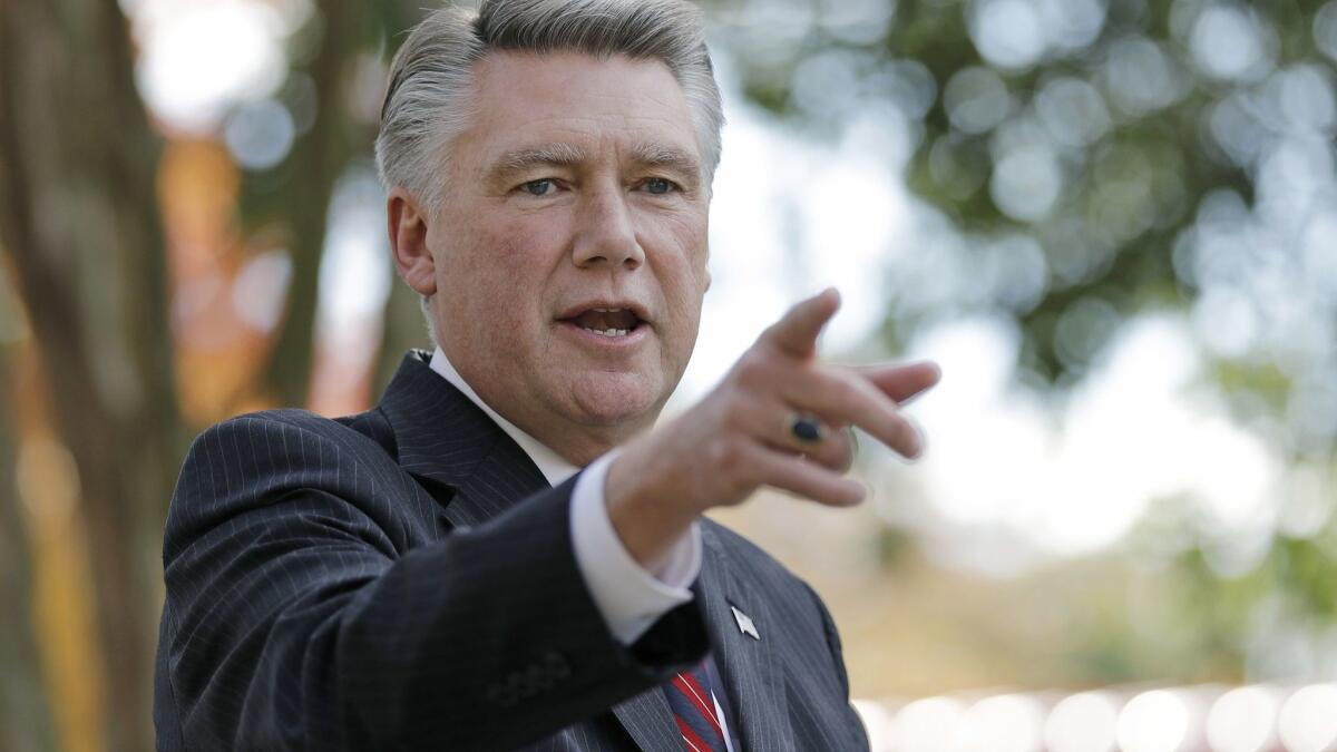 Mark Harris, who is clinging to a lead in the last unsettled Congressional race in the nation, speaks to the media during a news conference in Matthews, N.C.