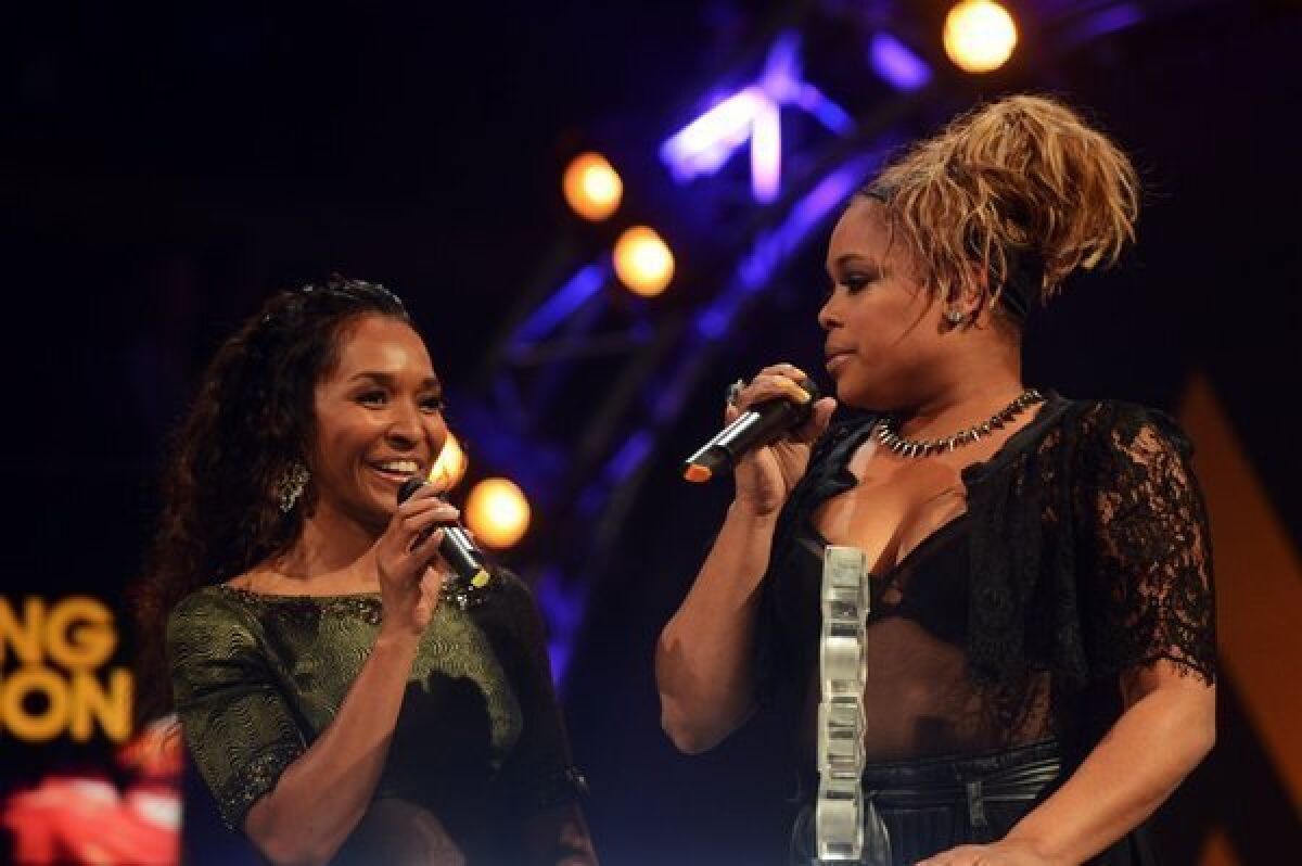 Rozonda "Chilli¿ Thomas" left, and Tionne "T-Boz" Watkins of TLC accept the award for Outstanding Contribution to Music at the 2012 MOBO awards in Liverpool, England.