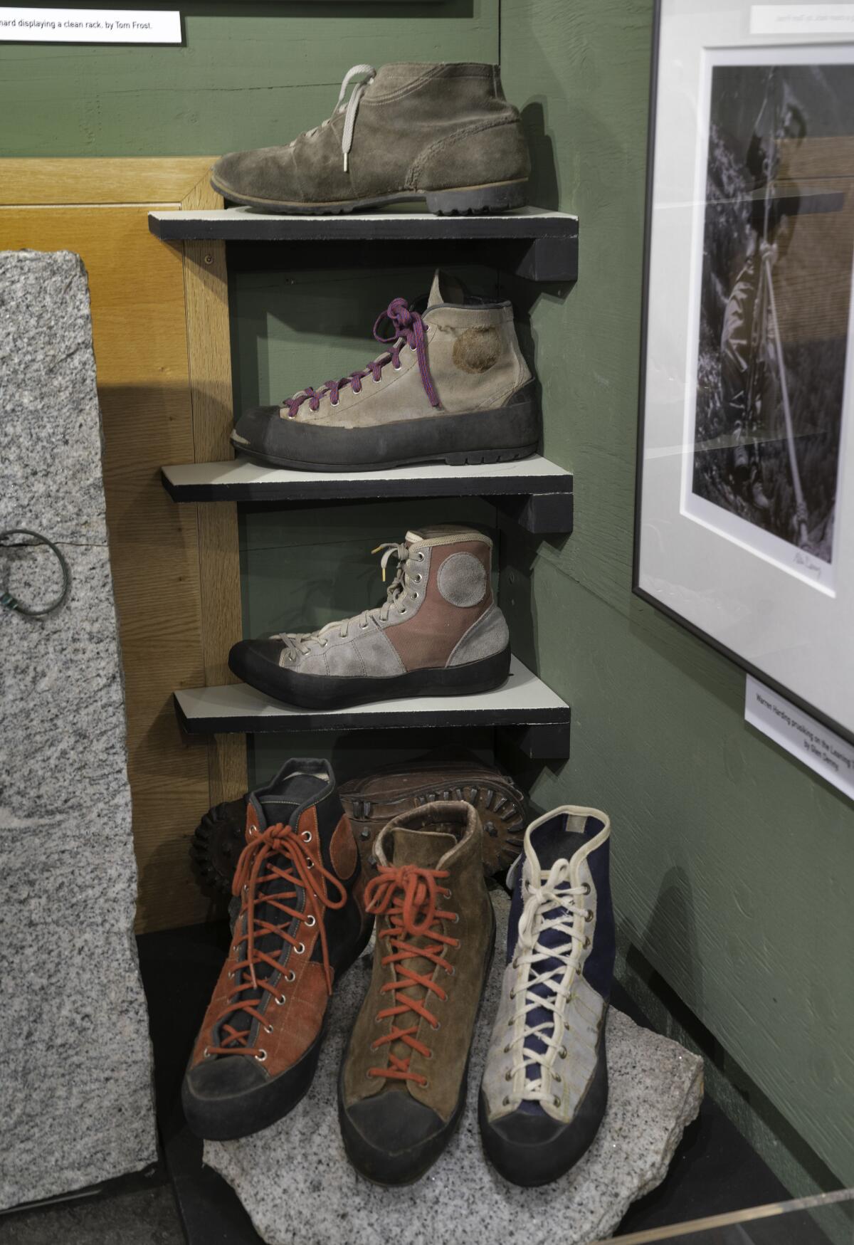 Old climbing boots on shelves