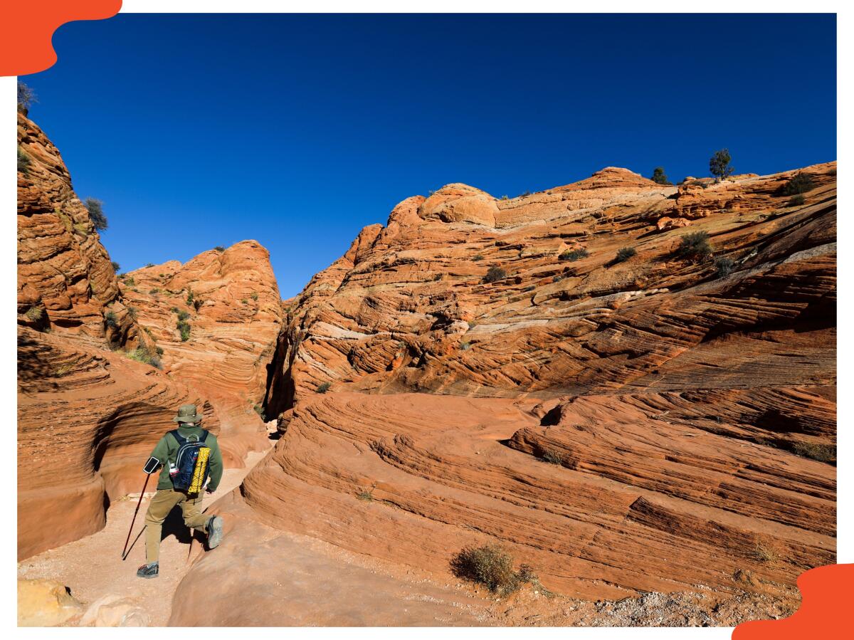 A hiker on a trail at Wire Pass Canyon near Kanab, Utah.