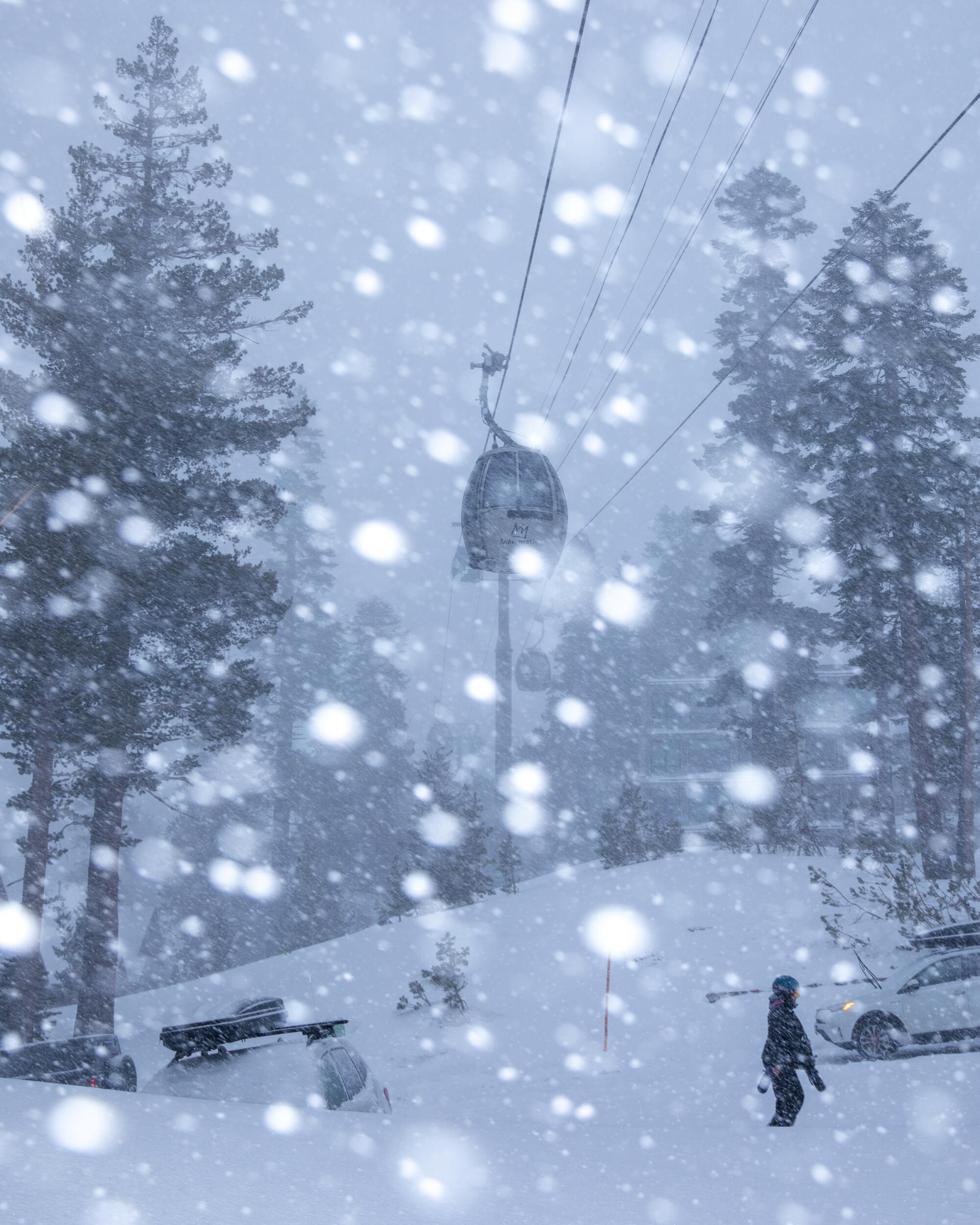 Snow falls on a scene of a person, pine trees, snow-covered ground, and an aerial lift.