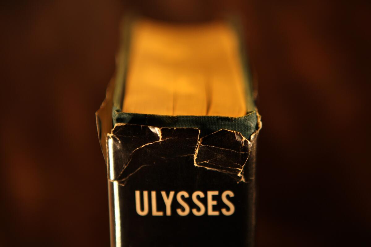 A tattered cover of a first edition printing of James Joyce's "Ulysses." A new history argues that Joyce contracted syphilis before he wrote the book.