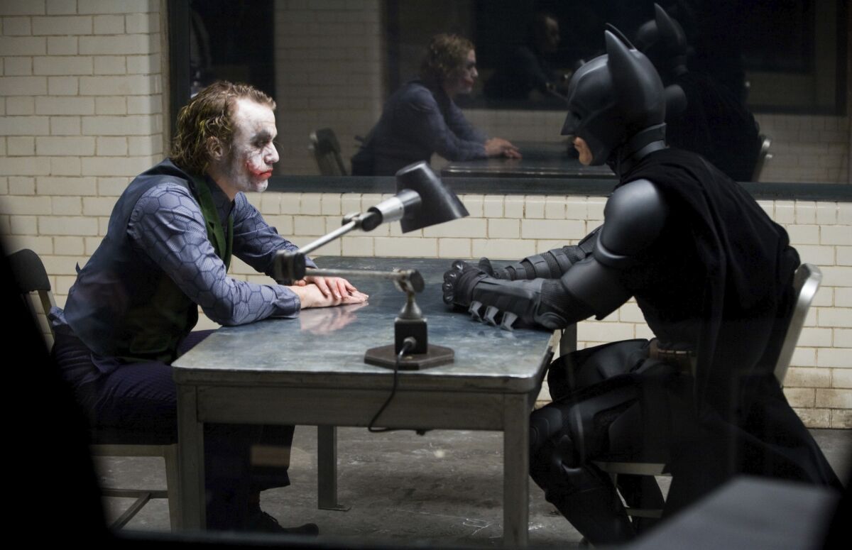 This image released by the Library of Congress shows Heath Ledger, left, and Christian Bale in a scene from the 2008 film "The Dark Knight." The film was added to the National Film Registry. (Warner Bros.-Library of Congress via AP)