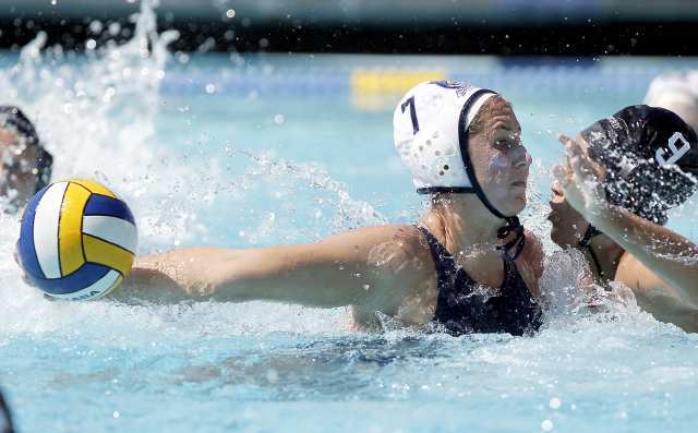 Newport Water Polo Foundation's Elissia Schilling (7) protects the ball during a USA Water Polo Junior Olympics game against Standford Red Thursday.