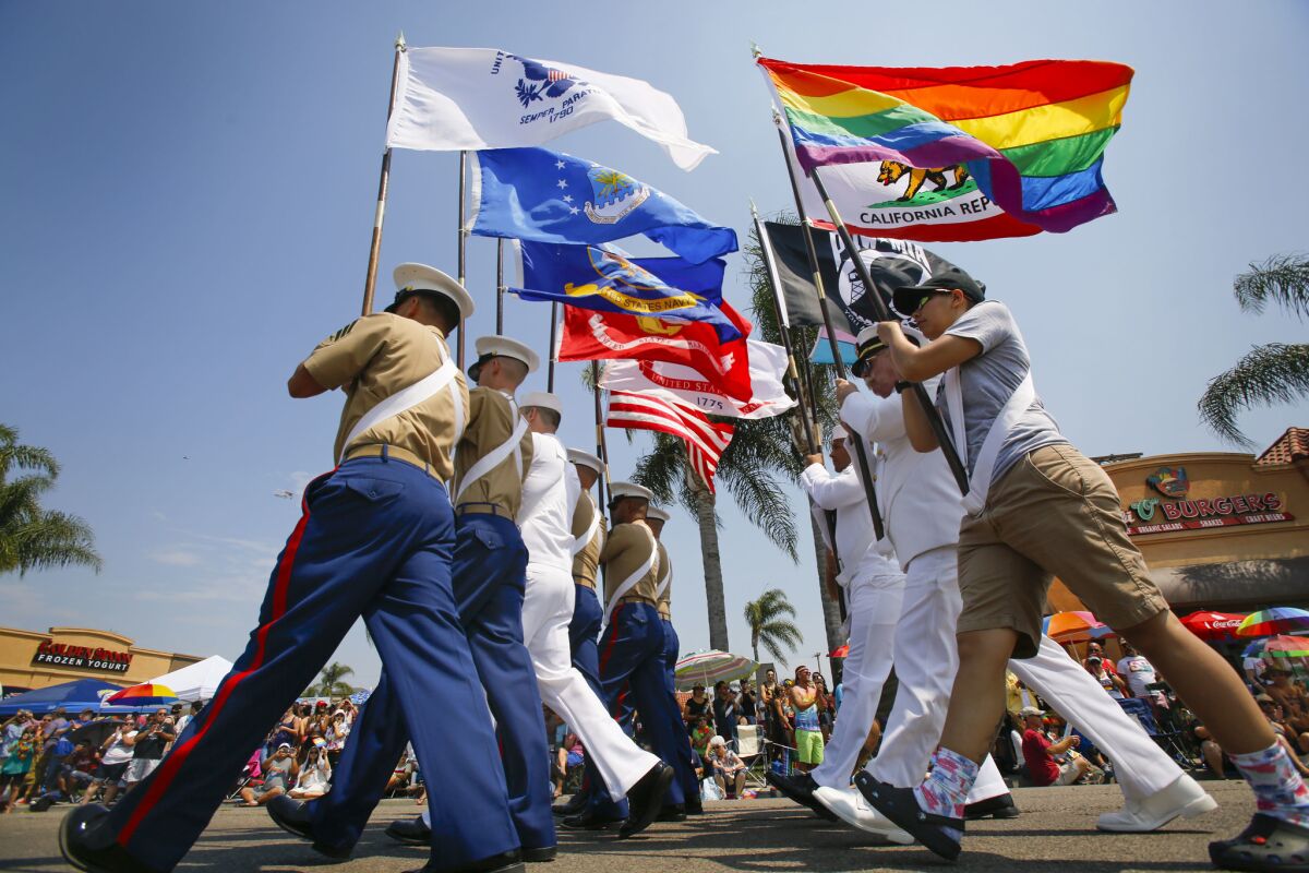 The color guard makes its way along University Avenue in Hillcrest during the 2017 San Diego Pride parade.