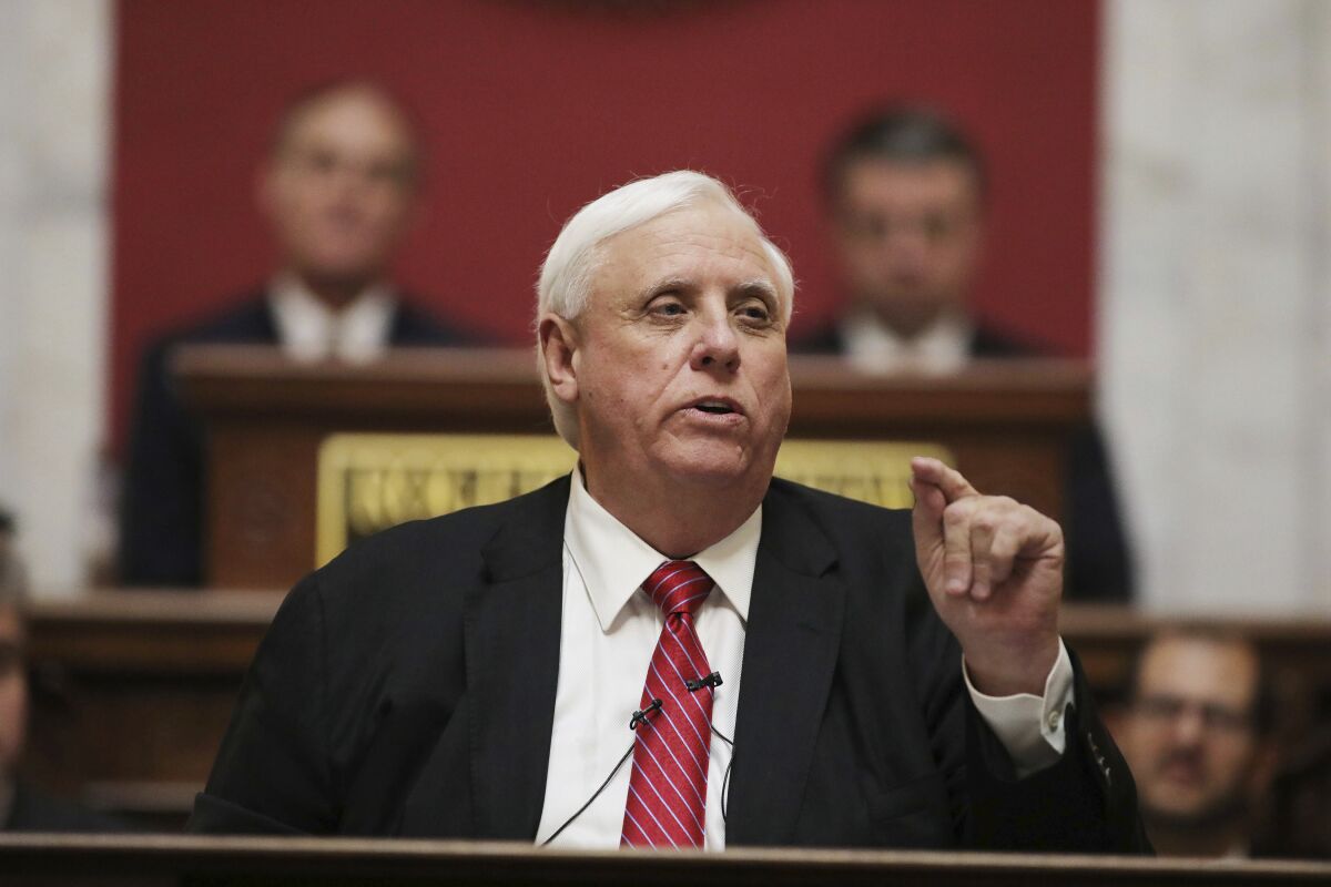 FILE - In this Jan. 8, 2020, file photo, West Virginia Governor Jim Justice delivers his annual State of the State address in the House Chambers at the state capitol, in Charleston, W.Va. A virtual trial pitting billionaire coal magnate and West Virginia Gov. Justice and two of his family-owned coal companies against a Pennsylvania coal exporter is set to resume in on Sept. 15, in Delaware. (AP Photo/Chris Jackson, File)