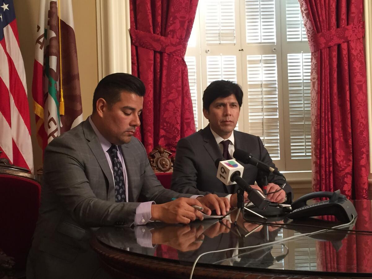 Sen. Ricardo Lara (D-Bell Gardens), left) and Senate President Pro Tem Kevin De Leon (D-Los Angeles) speak at a news conference touting the benefits to immigrants in the budget deal announced Tuesday.