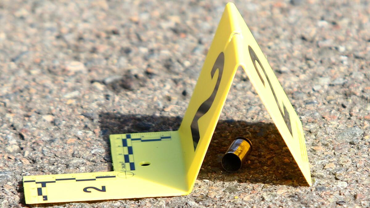 A bullet casing is marked at the scene of a deadly shooting at Umpqua Community College in Roseburg, Ore. in 2015.