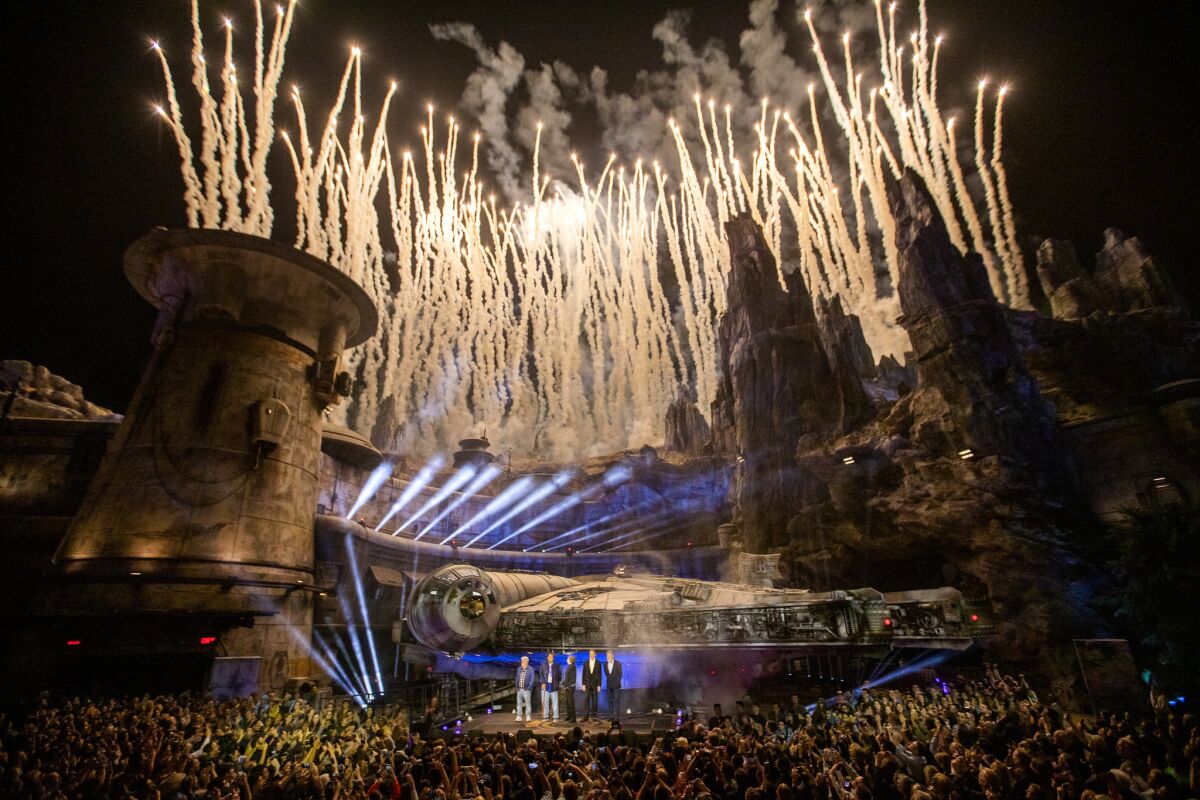 Fireworks explode over the the Millennium Falcon during the Star Wars: Galaxy's Edge unveiling at the Disneyland Resort.