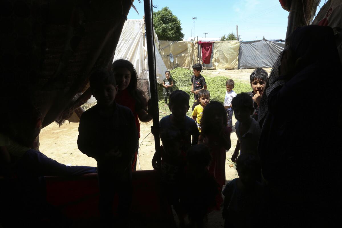 Syrian children play in a refugee camp near Amman, Jordan, on June 5.