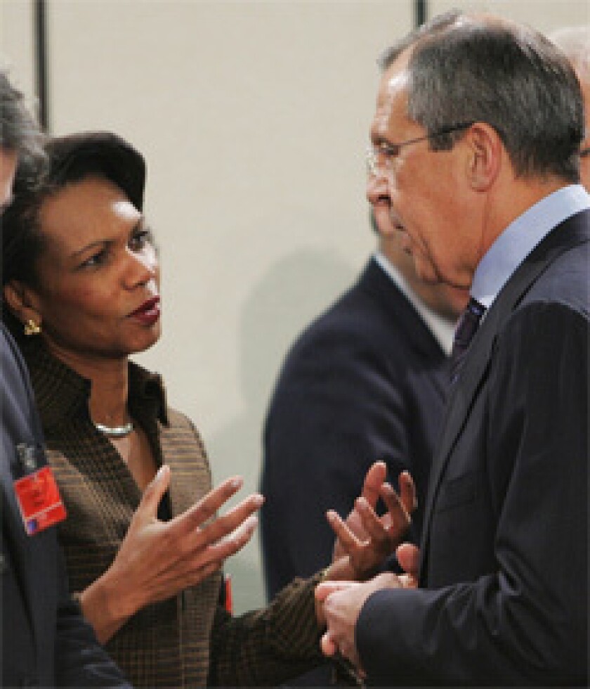FACE TO FACE: U.S. Secretary of State Condoleezza Rice speaks with Russian Foreign Minister Sergei V. Lavrov before a NATO meeting in Brussels last month. The two officials tangled over Iran last week, but Rice has called recent talk about a new Cold War hyperbolic nonsense.