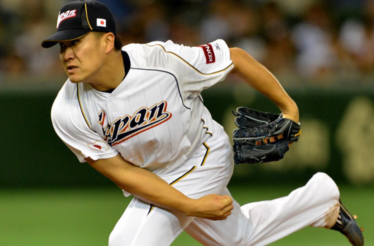 Masahiro Tanaka delivers a pitch against the Netherlands during a game in the World Baseball Classic.