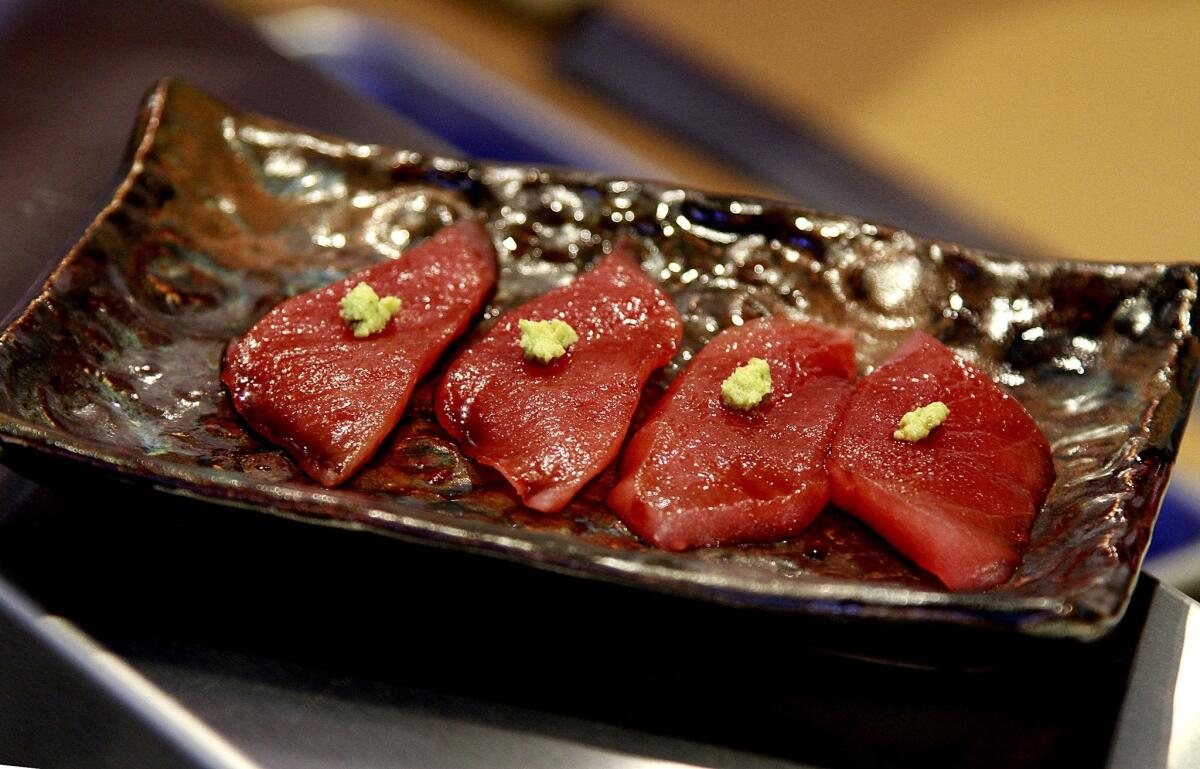 Butter-soft tuna is served with a dab of grated wasabi.