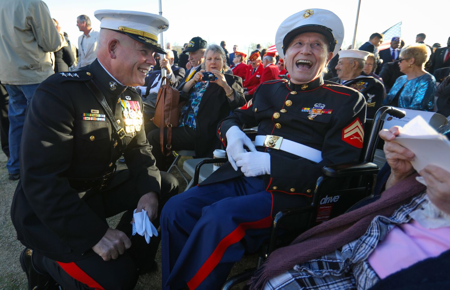 Marine Corps Lt. General Joseph L. Osterman, commanding general of the the I Marine Expeditionary Force, and Samuel Prestigiacomo, of Newport Beach, who was a Marine in the World War II Battle of Iwo Jima, enjoy a laugh before the commemoration ceremony for the 75th anniversary of the famous battle began at Camp Pendleton, February 15. This is the last time the Iwo Jima Commemorative Committee is planning to hold a formal West Coast gathering of veterans of the battle.