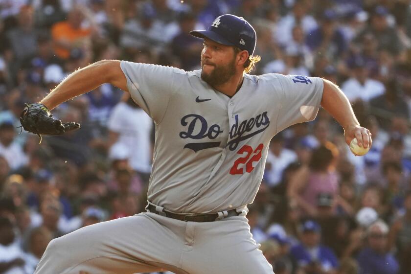 Los Angeles Dodgers starting pitcher Clayton Kershaw (22) throws against the Colorado Rockies.