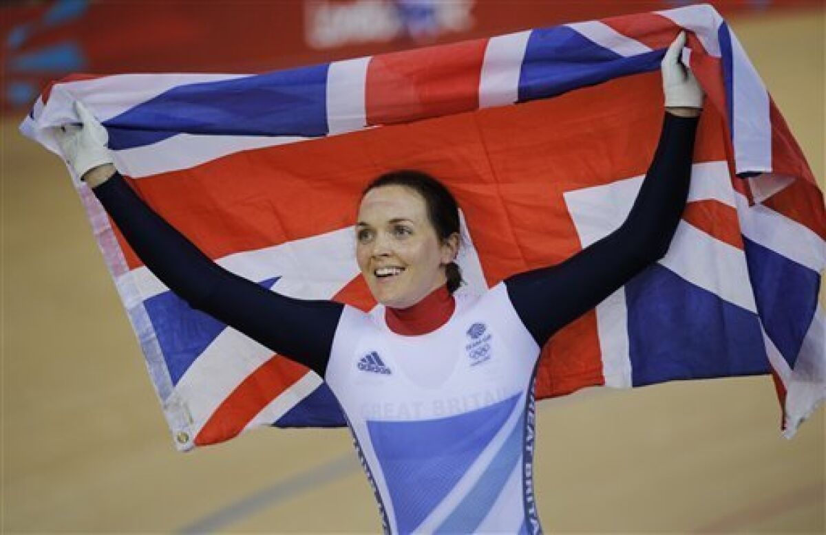 Britain's Victoria Pendleton celebrates after winning the gold in the track cycling women's keirin event, during the 2012 Summer Olympics in London, Friday, Aug. 3, 2012. Pendleton washed away the disappointment of her disqualification in the team sprint by claiming the gold medal in the keirin on Friday at the Olympics. (AP Photo/Christophe Ena)