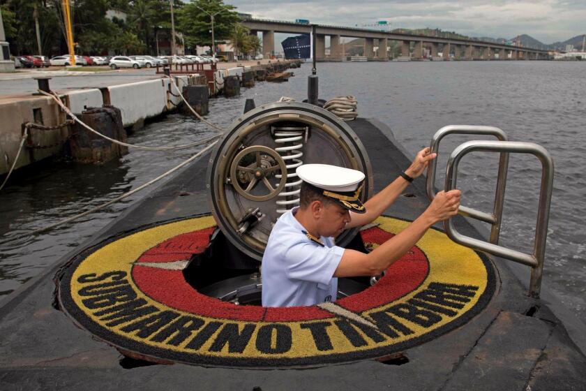 CORRECTION - Brazilian Navy Captain, Jose Americo Alexandre Dias, climbs the hatch of the Brazilian submarine Timbira, during a presentation to the press in Rio de Janeiro, Brazil, on November 22, 2017, whilst other vessels and aircrafts of the Brazilian Navy are taking part in the international search mission for missing Argentine submarine ARA San Juan. An international search mission for a missing Argentine submarine entered a critical phase Tuesday after nearly a week without signs of life -- as the vessel risked running out of oxygen after being submerged for so long. The ARA San Juan would have enough oxygen for its crew to survive underwater for seven days, if there was no hull breach, according to officials. At 0730 GMT Wednesday, that time will have elapsed. / AFP PHOTO / LEO CORREA / The erroneous mention[s] appearing in the metadata of this photo by LEO CORREA has been modified in AFP systems in the following manner: [whilst other vessels and aircrafts of the Brazilian Navy are taking part in the international search mission for missing Argentine submarine ARA San Juan.] instead of [which takes part in the international search mission for the missing Argentine submarine ARA San Juan]. Please immediately remove the erroneous mention[s] from all your online services and delete it (them) from your servers. If you have been authorized by AFP to distribute it (them) to third parties, please ensure that the same actions are carried out by them. Failure to promptly comply with these instructions will entail liability on your part for any continued or post notification usage. Therefore we thank you very much for all your attention and prompt action. We are sorry for the inconvenience this notification may cause and remain at your disposal for any further information you may require.LEO CORREA/AFP/Getty Images ** OUTS - ELSENT, FPG, CM - OUTS * NM, PH, VA if sourced by CT, LA or MoD **