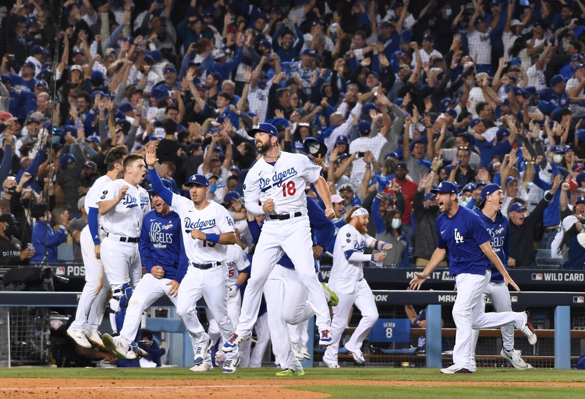 The Dodgers and their fans celebrate after defeating the St. Louis Cardinals 3-1 on Wednesday at Dodger Stadium.