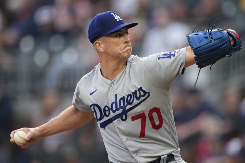 Los Angeles Dodgers starting pitcher Bobby Miller delivers in the first inning of a baseball game against the Atlanta Braves, Tuesday, May 23, 2023, in Atlanta. Miller was making his Major League debut. (AP Photo/John Bazemore)