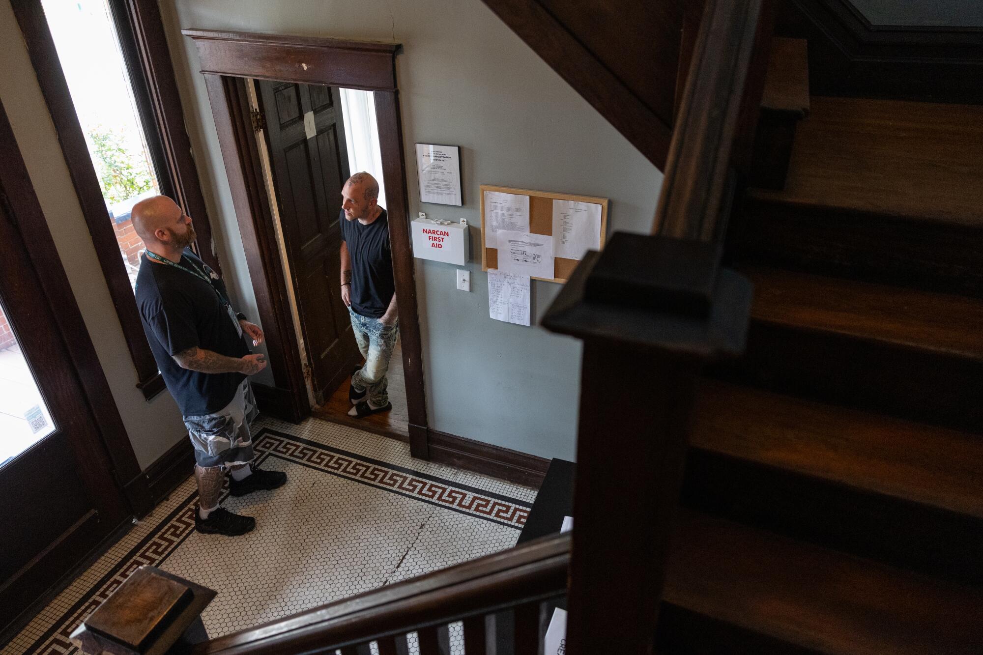 Blake Orner,(right) stands in the doorway of his bedroom as he talks with Fred Von