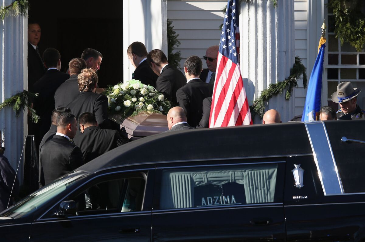A casket carrying the body of slain teacher Victoria Soto arrives to the Lordship Community Church on Wednesday in Stratford, Conn. The first-grade teacher died while protecting her students during Friday's shooting at Sandy Hook Elementary School.