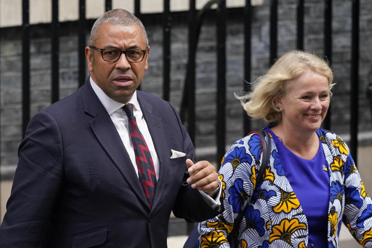 Britain's Foreign Secretary James Cleverly, left, and Vicky Ford, development minister in the Foreign Office leave 10 Downing Street in London, Wednesday, Sept. 7, 2022 after attending the first cabinet meeting since Liz Truss was installed as British Prime Minister a day earlier. (AP Photo/Alberto Pezzali)