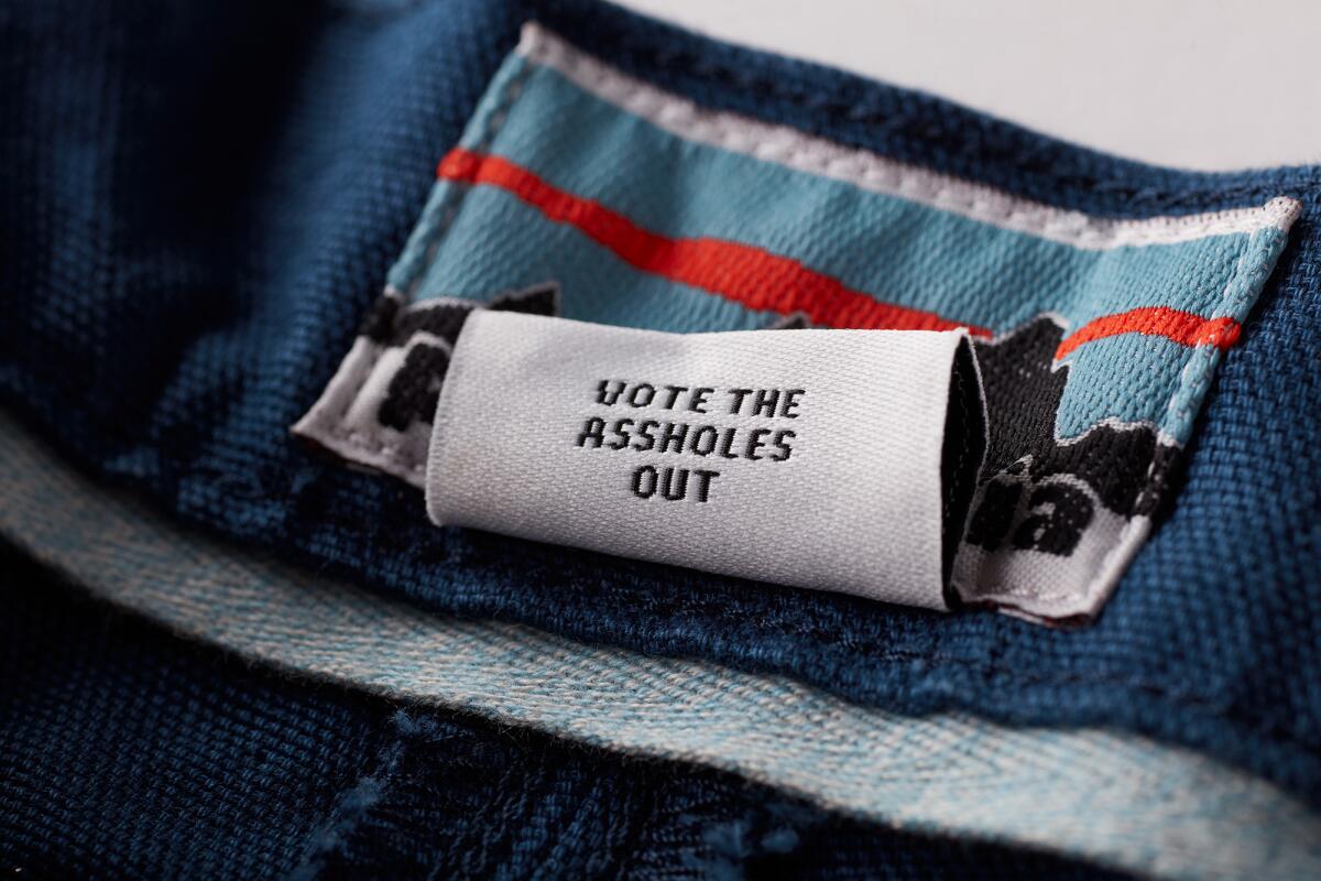 A "vote the asshole out" tag on a limited-edition pair of Patagonia's Stand Up Shorts.
