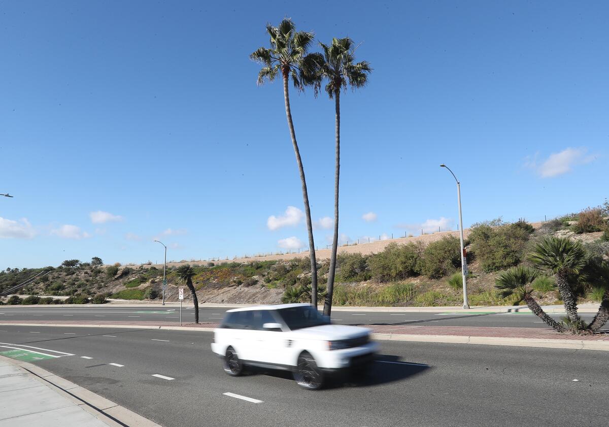 Cars drive down Superior Avenue.