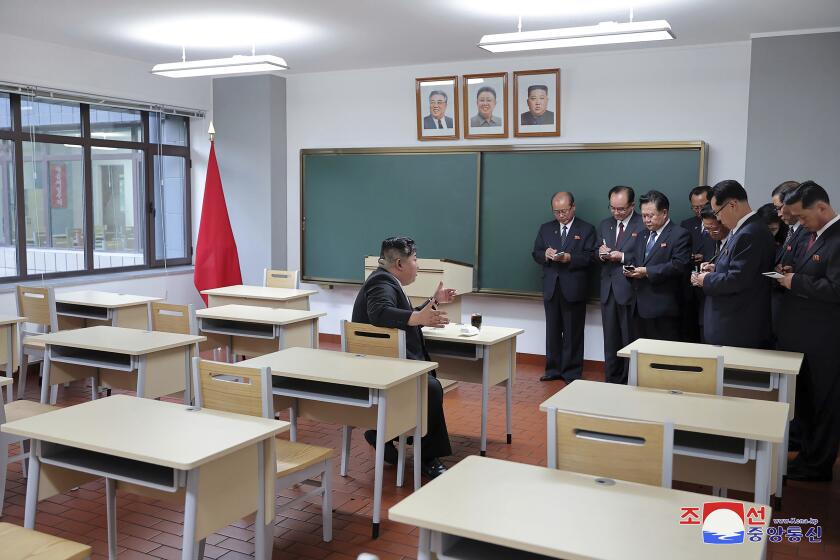 In this photo provided by the North Korean government, North Korean leader Kim Jong Un, left, inspects a class room of a newly built central cadres training school in Pyongyang, North Korea, Tuesday, May 21, 2024. Independent journalists were not given access to cover the event depicted in this image distributed by the North Korean government. The content of this image is as provided and cannot be independently verified. Korean language watermark on image as provided by source reads: "KCNA" which is the abbreviation for Korean Central News Agency. (Korean Central News Agency/Korea News Service via AP)