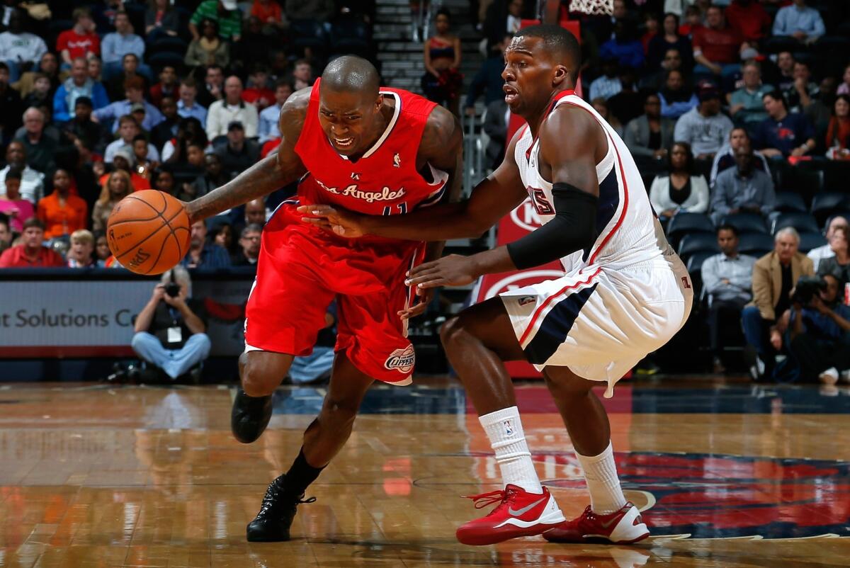 Clippers guard Jamal Crawford, left, drives past Atlanta's Shelvin Mack during the Clippers' loss Wednesday. Crawford is averaging 15.8 points per game this season.