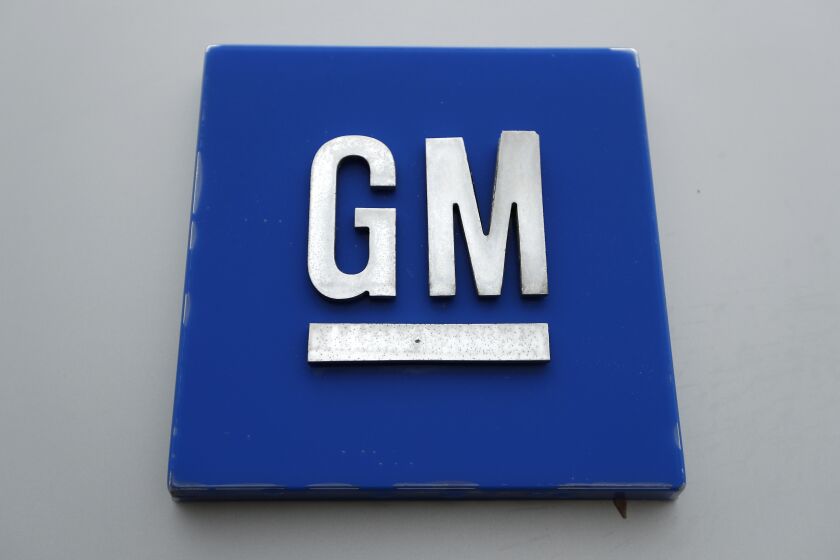FILE - A General Motors logo is displayed outside the General Motors Detroit-Hamtramck Assembly plant on Jan. 27, 2020, in Hamtramck, Mich. A joint venture announced Friday, Dec. 2, 2022, between General Motors and South Korean battery company LG Energy Solution says it will invest an additional $275 million to expand a Tennessee battery cell factory for electric vehicles. (AP Photo/Paul Sancya, File)