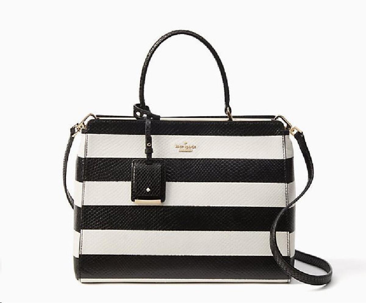 A Kate Spade snake-embossed leather, black-and-white striped Benson Angelika carry-all bag with adjustable cross-body strap, $548.